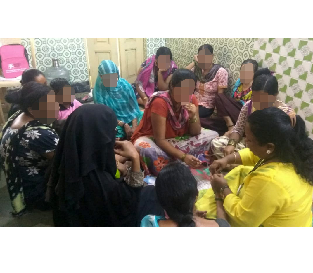 Chaaya, in the center of this picture, participates in a crafting workshop of the Butterfly project with other beneficiaries.